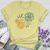 Because He Lives Floral Scene Softstyle Tee