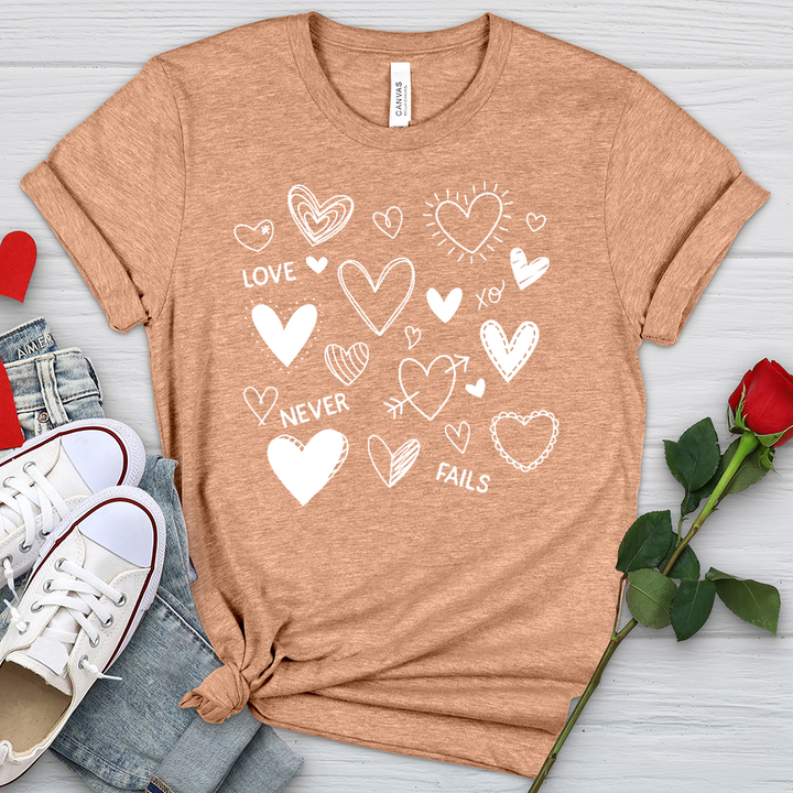 Love Never Fails Assorted Hearts Heathered Tee